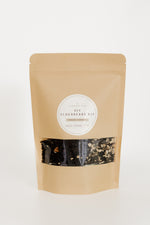 Kraft paper pouch of Pioneer Pam DIY Elderberry Kit for immune support, with a window showing dried elderberries and spices, on a white background.