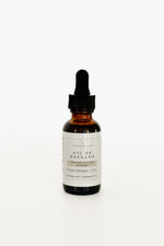 Amber glass dropper bottle of Pioneer Pam Oil of Oregano immune system support tincture on a white background.